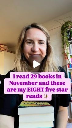 a woman holding a stack of books in front of her face with the words read 29 books in november and these are my eight five star reads