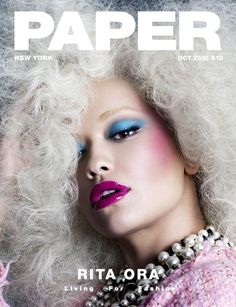 a woman with white hair and blue eyeshades on the cover of paper magazine