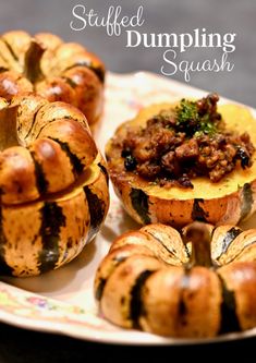 stuffed pumpkin squash on a plate with other dishes