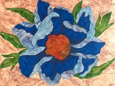 a blue flower with green leaves is on a brown background and has an orange center