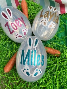 three personalized glass bowls with carrots and grass