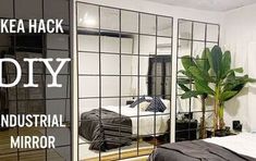 an industrial bedroom with mirrored walls and plants in the corner, as well as a bed