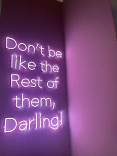 a neon sign that says don't be like the rest of them, daring