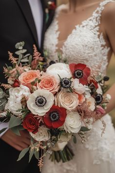 the bride and groom are holding their wedding bouquet