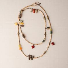 Beachy 38" Necklace 38" single-strand beaded necklace is composed of Mali clay beads, assorted agates, aquamarine,  smoky quartz, prehnite, peridot, carnelian, brass beads, and more.  GIFTABLE A jewelry gift pouch is included. The pouch will differ from the one photographed. A representative sample is shown. SIZE Necklace 38" adjustable (shown doubled) This necklace is shown nested inside the 40" necklace in the group photo. COORDINATING PIECES Turquoise Blue Ashanti Earrings... https://www.etsy.com/listing/1715080888/ashanti-and-mali-clay-bead-earrings?ref=listings_manager_table Seaglass Green Ashanti Earrings... https://www.etsy.com/listing/1715083070/ashanti-and-mali-clay-bead-earrings?ref=listings_manager_table Necklace 40"... https://www.etsy.com/listing/1715075458/neutral-necklace-40 Bohemian Long Necklace With Natural Stones For Layering, Bohemian Single Strand Beaded Necklaces For Layering, Bohemian Hand-strung Necklaces For Layering, Brown Long Necklace With Natural Stones, Bohemian Beaded Agate Long Necklace, Bohemian Double Strand Long Necklace With Natural Stones, Bohemian Agate Beaded Long Necklace, Bohemian Long Necklace With Round Beads For Layering, Lariat Beaded Necklaces With Natural Stones For Jewelry Making