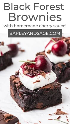 chocolate brownies with cherries and whipped cream on top