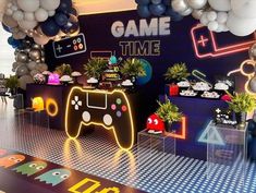 a video game themed party with balloons and decorations