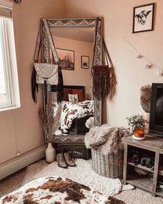 a living room with a large mirror on the wall and a cow hide rug on the floor