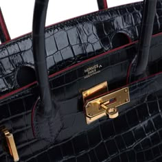 This limited edition Hermes Contour Birkin is in Bleu Marine Shiny Porosus Crocodile leather with contour Rouge H edge paint and gold hardware, tonal stitching, front flap with two straps, front toggle closure, clochette with lock and two keys, double rolled handles.The interior is lined in Bleu Marine chevre leather and has a zip pocket with Hermes engraved pull; pocket on opposite side.Collection: AOrigin: FranceCondition: Never worn - (plastic on the hardware except for the feet resulting in some hairline scratches)Accompanied by: Hermes box, Hermes dustbag, clochette, lock, two keys, clochette dustbag, felt and CITESMeasurements: 11.75" width x 9.5" height x 6" depth; 4.25" handle drop Birkin Bag With Scarf, Red Luxury Bag, Hermes Limited Edition Bag, Black Hermes Birkin, Birkin Bag Hermes, Hermes Crocodile Bag, Vintage Hermes Bag, Hermes Leather, Givenchy Bags