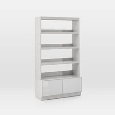 a white bookcase with two drawers on the bottom and one drawer below it, against a gray background