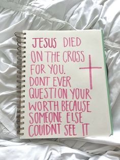 a note book with the words jesus died on the cross for you, don't ever question your worth because someone else couldn set it