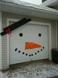 a garage door decorated to look like a snowman