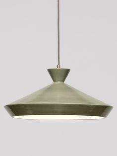 a green light hanging from a ceiling fixture