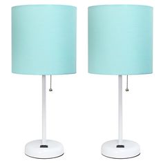 two white table lamps with blue shades on them