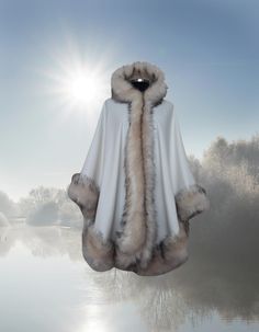 ⫸ Fast & safe Express delivery! ⫸Use Coupon Code COMEBACK%10 discount at checkout if put your item in your cart from HandmadebyNadya Plus Size One of a kind  alpaca Hooded cape with vegan Fox fur trim is elegantly stylish and perfectly balanced for a flattering fit, Throw this full circle alpaca cape over everything from your most elegant wear. *Expertly hand made, unique and has been created with luxury  fabric with fur to be worn and treasured for years to come, * Double hook and eye closure to secure cape to body **Hidden underarm snap closure to create optional sleeve * Neck loop for hanging your cape and easy storage *Fur is long, lush and silky *The Fur trim is hand-stitched all around the cape Measurement: Fur trim measures approx. 5 inches (13 cm) wide Cape Center back length measu Cashmere Cape, Small Business Gifts, Hooded Cape, Cape Coat, Plus Size Kleidung, Fox Fur, Winter Wear, Comfortable Outfits, Fur Trim