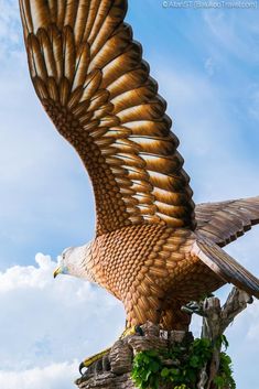 a statue of an eagle flying through the air