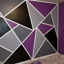 a purple and black wall with white squares on it