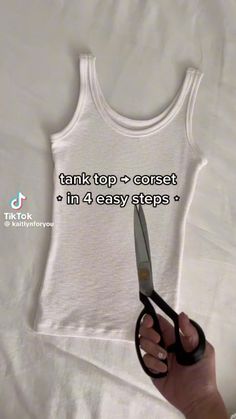 someone is holding scissors in front of a tank top that says, think top - correct in 4 easy steps