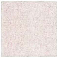 a white and pink rug with small squares on the bottom, in different sizes and colors