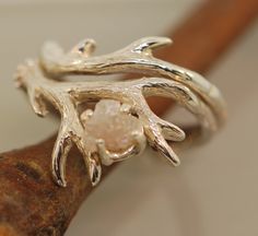 Antler 2 Set with Raw Diamond Original Design Made in the USA Unique and beautifuly detailed these antlers feature a rough natural diamond. This listing is for 2 rings, the engagement ring and the band. The diamond is around 4.5 to 5.5 mm. This antler ring set can be purchased in sterling silver, 14 karat rose, yellow or white gold. If you would like a different karat gold or metal please let me know. The diamonds are silver white to silver. This set makes a great alternative wedding ring, truly Deer Rings, Deer Antler Ring, Golden Deer, Raw Diamond Rings, Alternative Wedding Rings, Rough Diamond Ring, Antler Ring, Twig Ring, Rings Unique