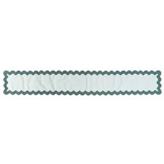 a white and green border with scalloped edges