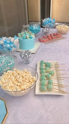 there are many desserts on the table ready to be eaten at this birthday party