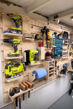 a workbench with various tools on the wall