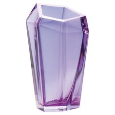 a purple glass vase sitting on top of a white table