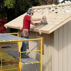 a man working on the roof of a building