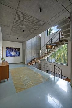 the inside of a modern house with stairs