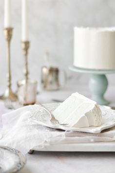 a piece of cake sitting on top of a plate next to a knife and fork