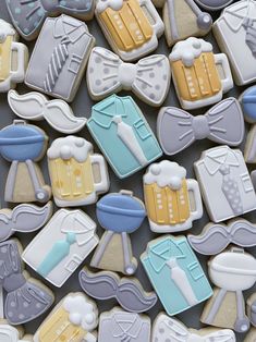 some cookies that are decorated to look like men's clothes and beer mugs