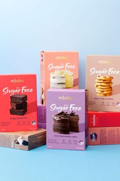 four boxes of sugar free desserts on a blue background