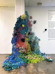 there is a sculpture made out of colored paper