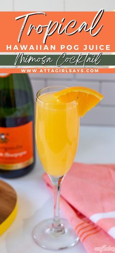 a glass filled with orange juice on top of a table