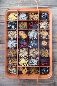 an orange tray filled with lots of different types of treats