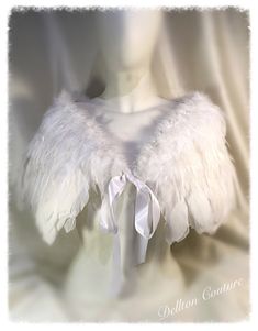 "Angel White feather capelet cape looks amazing when worn.  Vintage inspired this is perfect for bridal shoulder cover accessory.  The top of the wrap measures 40\"  depth at the back 11\" Fully lined  with ribbon ties one size fits all Thanks Sally X Please allow extra time to receive your item from time of purchase if posting overseas sent by Royal Mail Tracked and Signed for. If purchased in the UK the item will be posted by Royal Mail Signed 2nd Class If you would like to send a stamped addr White Feather Headpiece, Feather Capelet, Feathered Cape, Feather Outfit, Angel Accessories, Feather Cape, Feather Coat, Angel Feathers, Feather Headpiece