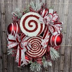 a christmas wreath with candy canes and ornaments