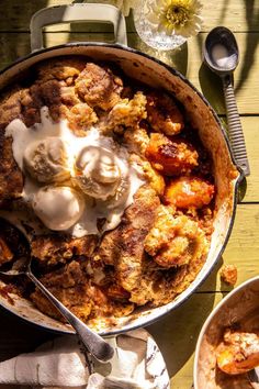 a pot filled with food sitting on top of a wooden table