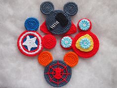 crocheted mickey mouse appliques are arranged in the shape of captain america