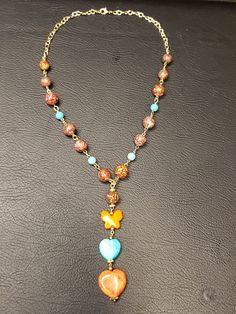 Orange, Blue and Brown Reconstructed Turquoise and Ceramic Beaded Necklace with Gold Links  Neclace: 21.5 inches and weighs 1.8 lbs Brown Necklace, Blue And Brown, Beaded Necklaces, Material Girls, Porcelain Ceramics, Jewelry Necklace, Seed Beads, Brooklyn, Etsy Accessories