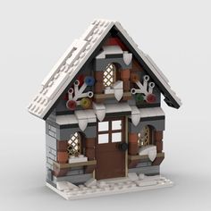 a lego house with lots of decorations on the roof