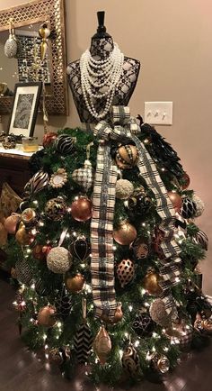 a dress made out of christmas ornaments on display