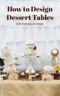 a table topped with cakes and desserts on top of a cloth covered tablecloth