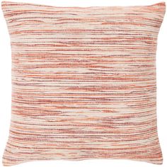 an orange and white striped pillow with fringes on the front, in neutral colors