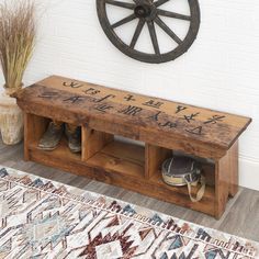 a wooden bench with chinese writing on it and two pairs of shoes under the bench