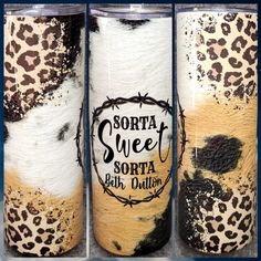 three different colored tumbles with black and white designs on them, one is leopard print