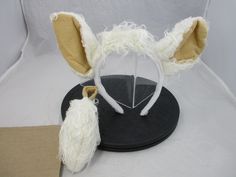 Wanting to become one of the cutest animals in the kingdom? This kit is Plush Llama Set is perfect! Lightweight and comfortable to wear. These furry ears headband and tail set is one size fits most adults and some teens. Tail has loop for attachment with a belt or pin(not included). Great for parents wanting to have fun on Halloween, School Parties, and more! Spot Clean only Handmade, assembled, and crafted by hand with assistance from hand driven fabric forming and hand driven sewing equipment. White Halloween Costume, Sheep Mask, White Halloween Costumes, Sewing Equipment, White Halloween, Cutest Animals, Funny Costumes, Ears Headband, Halloween School