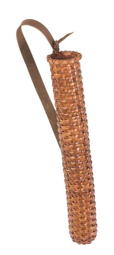 a woven vase with a brown ribbon around it's neck on a white background