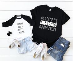 two t - shirts that say i'm the mom, mommy has a pouty mouth